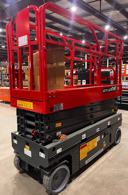 GTJZ08 Electric Scissor Lift full view in warehouse

Platform view showing foldable guardrails

Lift extended to 10M with worker on platform

Side profile highlighting tire system

Control panel and safety features close-up