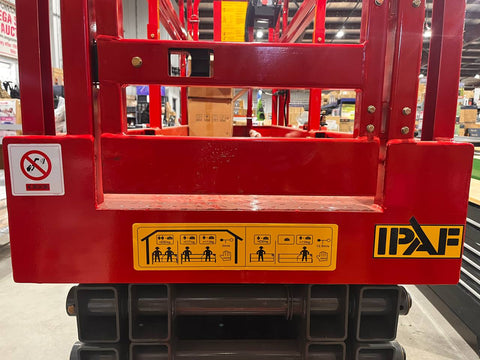 GTJZ08 Electric Scissor Lift full view in warehouse

Platform view showing foldable guardrails

Lift extended to 10M with worker on platform

Side profile highlighting tire system

Control panel and safety features close-up