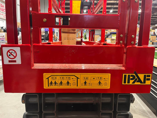 GTJZ08 Electric Scissor Lift full view in warehouse

Platform view showing foldable guardrails

Lift extended to 10M with worker on platform

Side profile highlighting tire system

Control panel and safety features close-up