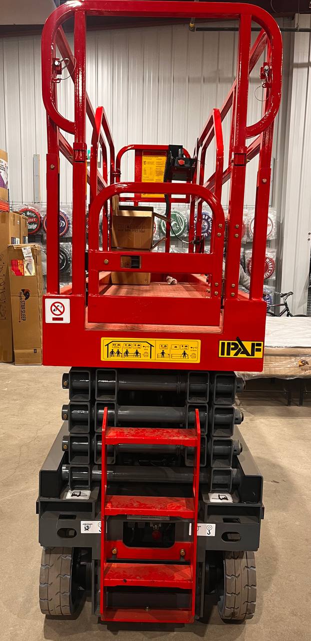 GTJZ08 Electric Scissor Lift full view in warehouse

Platform view showing foldable guardrails

Lift extended to 10M with worker on platform

Side profile highlighting tire system

Control panel and safety features close-up