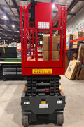 GTJZ08 Electric Scissor Lift full view in warehouse

Platform view showing foldable guardrails

Lift extended to 10M with worker on platform

Side profile highlighting tire system

Control panel and safety features close-up