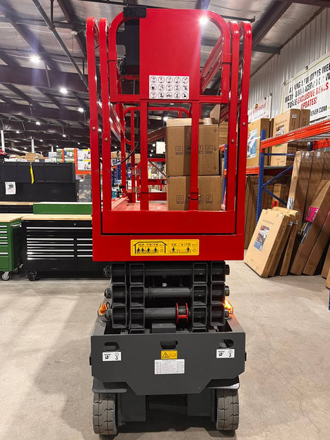 GTJZ08 Electric Scissor Lift full view in warehouse

Platform view showing foldable guardrails

Lift extended to 10M with worker on platform

Side profile highlighting tire system

Control panel and safety features close-up