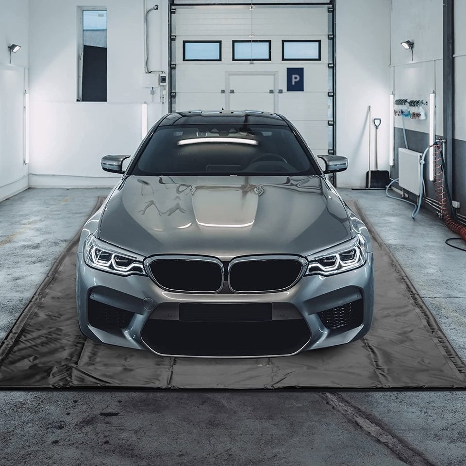 garage containment mat for winter snow and water protection
SUV parked on 8.6x20 ft waterproof garage mat
car on 8x18 ft floor containment mat in garage