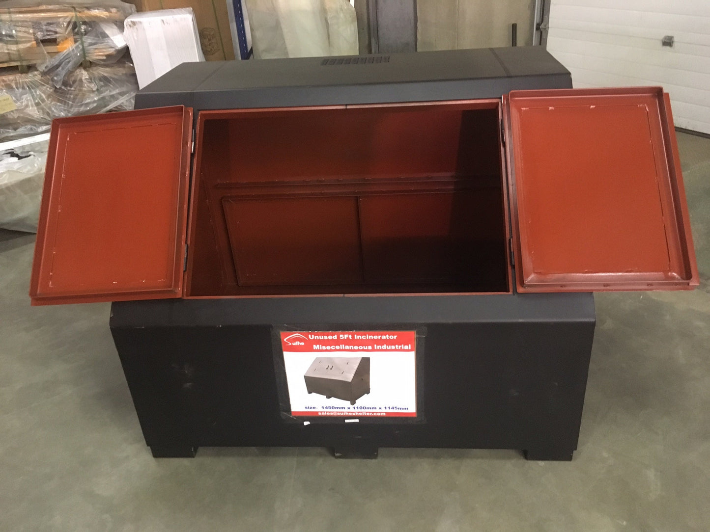“Top view of black steel garbage incinerator fire pit with vent holes”

“Steel incinerator box with forklift access and reinforced lid”

“High-efficiency vented garbage burner with heavy-duty design”

“Open view of fire pit incinerator showing internal air grates”

“Steel waste disposal incinerator with front-loading forklift pockets”