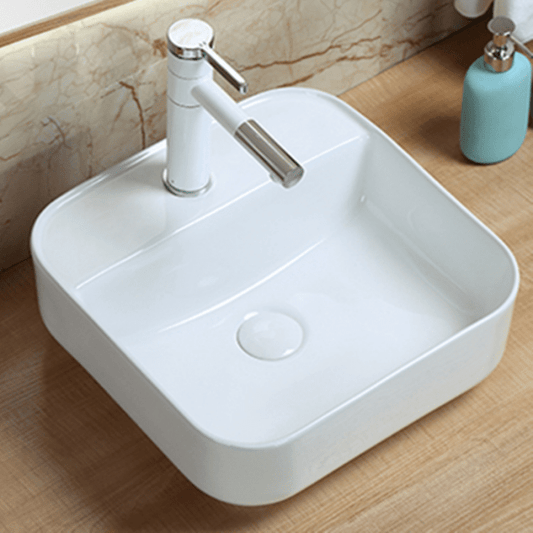 Modern countertop bathroom sink basin in white ceramic
Above counter square vessel sink installed on wooden vanity
Bathroom vanity bowl with chrome faucet and soap dispenser
Dimensions of square countertop sink with standard drain hole
Side and top view of glossy white vessel sink for powder room