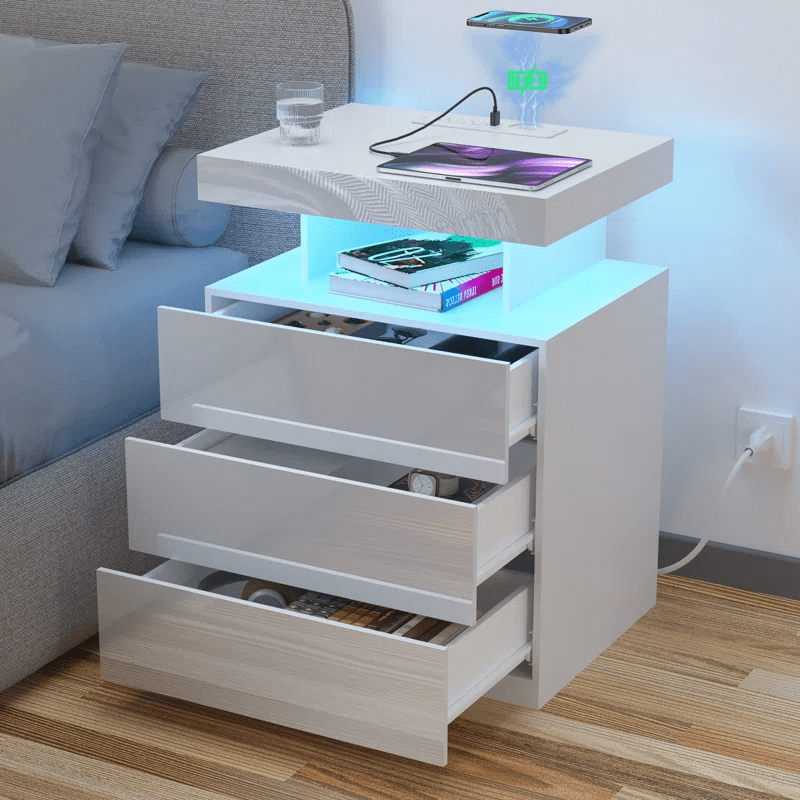 White Modern Nightstand with LED Lights and Charging Ports

Black Nightstand with RGB Lighting in Bedroom Setup

Smart Nightstand with Glowing LED Drawers – White Finish

Compact Bedside Table with Built-In Outlets and Lights

Modern Nightstand with Power Outlets and Drawer Storage

