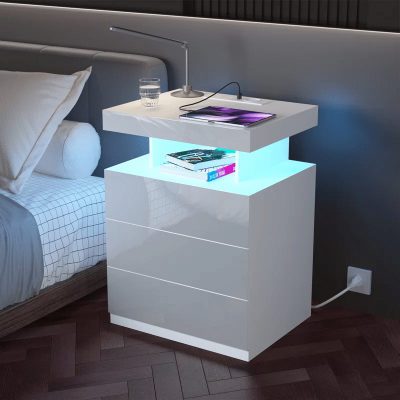White Modern Nightstand with LED Lights and Charging Ports

Black Nightstand with RGB Lighting in Bedroom Setup

Smart Nightstand with Glowing LED Drawers – White Finish

Compact Bedside Table with Built-In Outlets and Lights

Modern Nightstand with Power Outlets and Drawer Storage