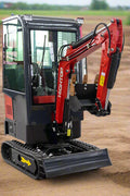1 Ton Mini Excavator with red exterior and enclosed cab

Excavator attachments: auger, rake, ripper tooth

Briggs & Stratton engine close-up in compact excavator

Compact excavator operating on residential job site

Interior view of enclosed cab on mini excavator