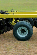 Yellow 10 ft offset disc harrow on field-ready tires
Side profile of 14 ft hydraulic disc harrow with black frame
17 ft disc harrow for large-scale farming operations
Rear angle of disc harrow showing disc blade spacing
Overhead view of disc harrow attachment connected to tractor