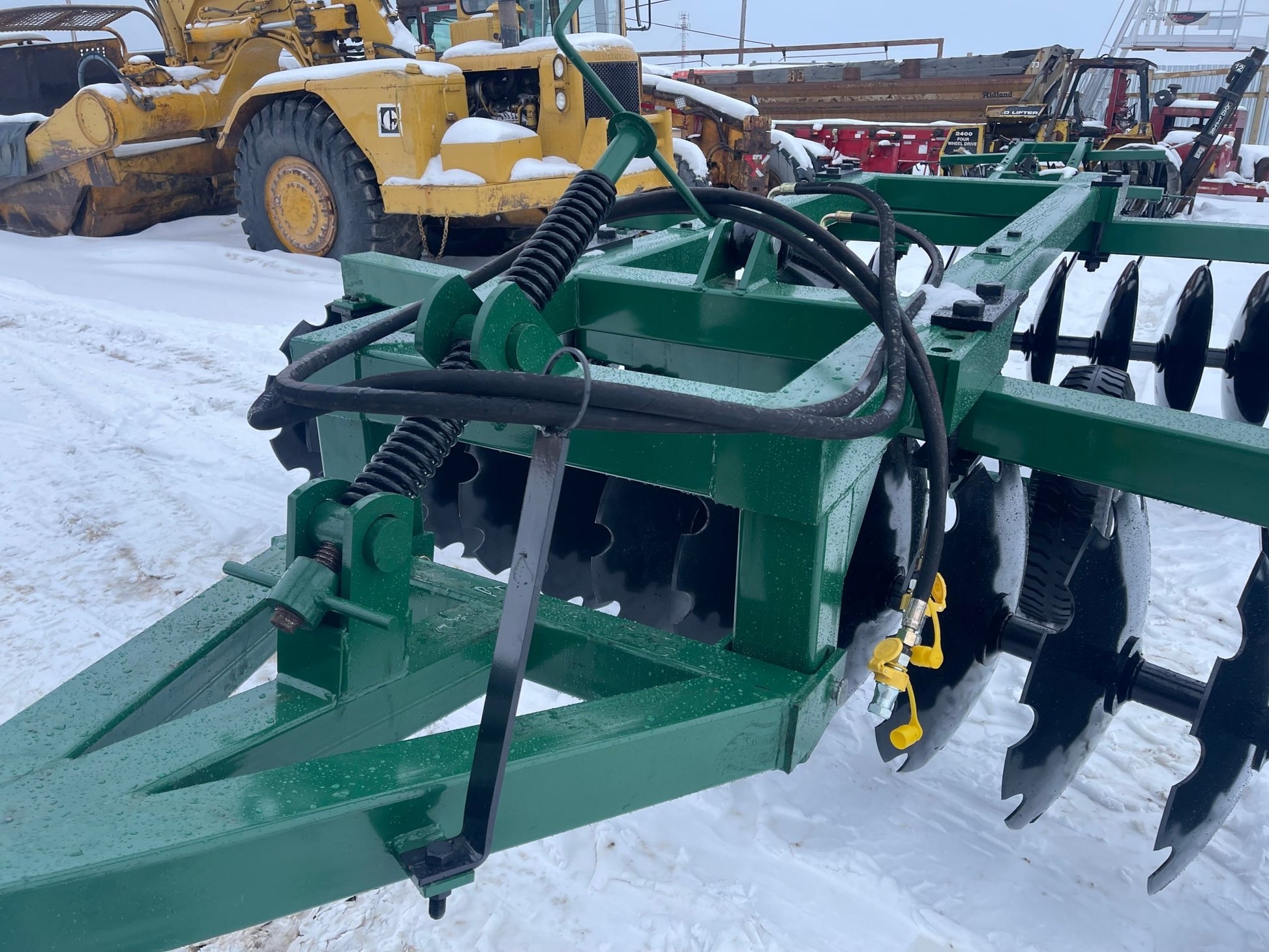 10 FT Hydraulic Offset Tractor Disc Harrow in field setup
Side view of 10-foot disc harrow with 28 manganese steel blades
Rear blade configuration of hydraulic disc harrow
Top view showing hydraulic tubing and disc spacing
Offset disc harrow mounted on green tractor for field work