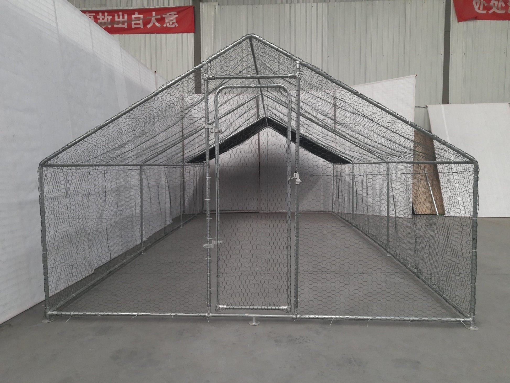 10x20 metal dog kennel cage with chicken wire fence

Walk-in outdoor animal enclosure for chickens or dogs

Backyard fenced compound with metal frame

Secure livestock pen with galvanized steel construction

Versatile pet and poultry cage outdoors