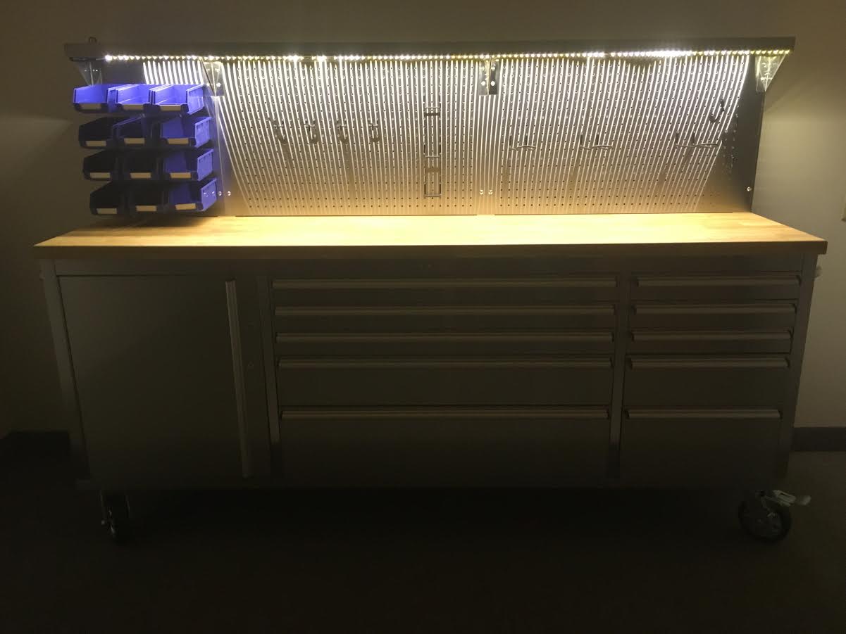 84" stainless steel tool bench with LED lighting and drawers

Solid wood top garage workbench with 11 storage drawers

Professional stainless steel tool station with LED bar

Close-up of drawer handles on heavy-duty tool bench

Industrial workbench with built-in lights and hardwood surface