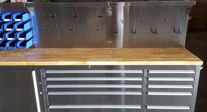 84" stainless steel tool bench with LED lighting and drawers

Solid wood top garage workbench with 11 storage drawers

Professional stainless steel tool station with LED bar

Close-up of drawer handles on heavy-duty tool bench

Industrial workbench with built-in lights and hardwood surface