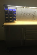 84" stainless steel tool bench with LED lighting and drawers

Solid wood top garage workbench with 11 storage drawers

Professional stainless steel tool station with LED bar

Close-up of drawer handles on heavy-duty tool bench

Industrial workbench with built-in lights and hardwood surface