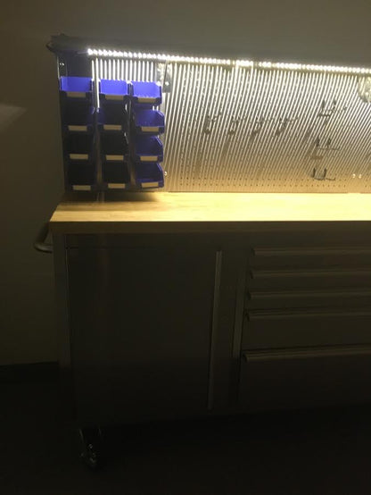 84" stainless steel tool bench with LED lighting and drawers

Solid wood top garage workbench with 11 storage drawers

Professional stainless steel tool station with LED bar

Close-up of drawer handles on heavy-duty tool bench

Industrial workbench with built-in lights and hardwood surface