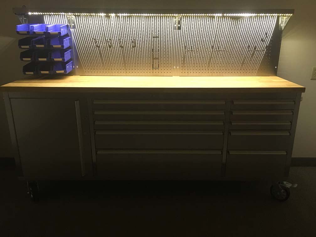 84" stainless steel tool bench with LED lighting and drawers

Solid wood top garage workbench with 11 storage drawers

Professional stainless steel tool station with LED bar

Close-up of drawer handles on heavy-duty tool bench

Industrial workbench with built-in lights and hardwood surface