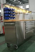 84" stainless steel tool bench with LED lighting and drawers

Solid wood top garage workbench with 11 storage drawers

Professional stainless steel tool station with LED bar

Close-up of drawer handles on heavy-duty tool bench

Industrial workbench with built-in lights and hardwood surface