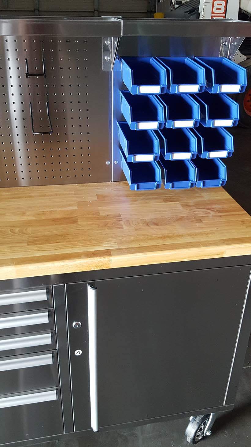 84" stainless steel tool bench with LED lighting and drawers

Solid wood top garage workbench with 11 storage drawers

Professional stainless steel tool station with LED bar

Close-up of drawer handles on heavy-duty tool bench

Industrial workbench with built-in lights and hardwood surface