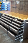 84" stainless steel tool bench with LED lighting and drawers

Solid wood top garage workbench with 11 storage drawers

Professional stainless steel tool station with LED bar

Close-up of drawer handles on heavy-duty tool bench

Industrial workbench with built-in lights and hardwood surface