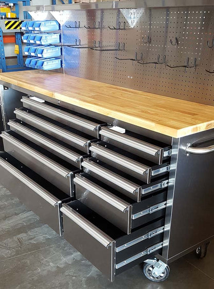 84" stainless steel tool bench with LED lighting and drawers

Solid wood top garage workbench with 11 storage drawers

Professional stainless steel tool station with LED bar

Close-up of drawer handles on heavy-duty tool bench

Industrial workbench with built-in lights and hardwood surface