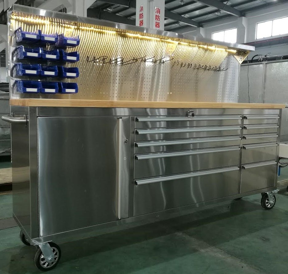 84" stainless steel tool bench with LED lighting and drawers

Solid wood top garage workbench with 11 storage drawers

Professional stainless steel tool station with LED bar

Close-up of drawer handles on heavy-duty tool bench

Industrial workbench with built-in lights and hardwood surface