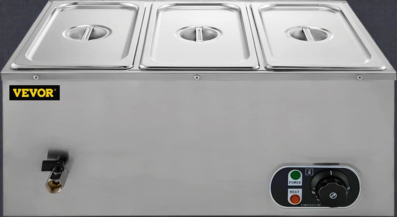 3-pan buffet food warmer front view with lid open

Commercial food warmer showing stainless steel interior

Temperature knob and heating element close-up

Buffet setup with food in all three compartments

Side view of removable pans with food steam