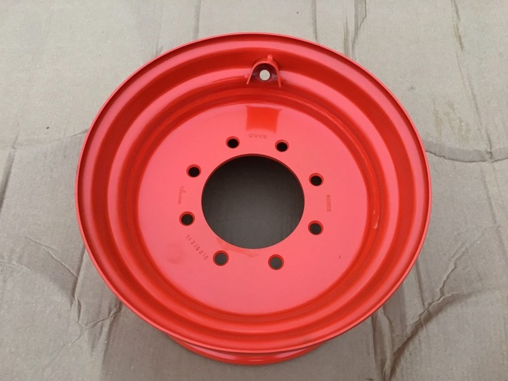 Red steel skid steer rim 9.75x16.5
8-lug Bobcat compatible wheel
Skid steer wheel for 12x16.5 tire
Red 16.5" rim for construction equipment
Heavy-duty skid steer wheel close-up