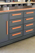 Heavy-duty steel workbench with 12 drawers and 2 cabinets – front view
Red metal tool storage bench for garage or workshop use
Industrial-grade 12-drawer workbench with welded backsplash