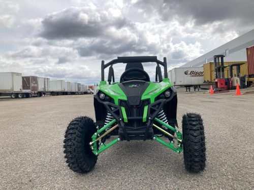 Front view of 1200W 48V Electric Go Kart UTV in green with roll cage

Side view showing suspension and knobby tires

Red electric off-road buggy for youth

Adjustable racing seat with seatbelt

Rear motor and chain drive close-up

Hydraulic disc brakes and rear suspension

Dual color variants: red and green off-road karts