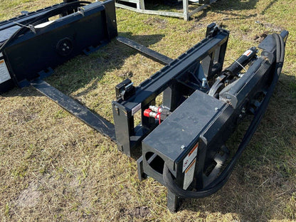 Rotating hydraulic skid steer pallet fork with 42” tines

HRB11172A attachment showing 127° rotation

Heavy-duty quick attach pallet forks for skid steer

Close-up of reinforced steel fork frame

Rotating fork in lifted pallet position on gravel site