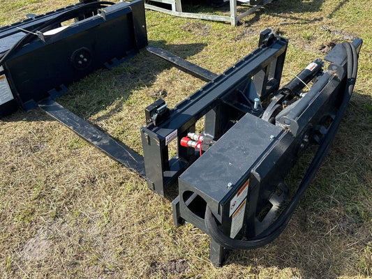 Rotating hydraulic skid steer pallet fork with 42” tines

HRB11172A attachment showing 127° rotation

Heavy-duty quick attach pallet forks for skid steer

Close-up of reinforced steel fork frame

Rotating fork in lifted pallet position on gravel site