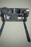 Rotating hydraulic skid steer pallet fork with 42” tines

HRB11172A attachment showing 127° rotation

Heavy-duty quick attach pallet forks for skid steer

Close-up of reinforced steel fork frame

Rotating fork in lifted pallet position on gravel site