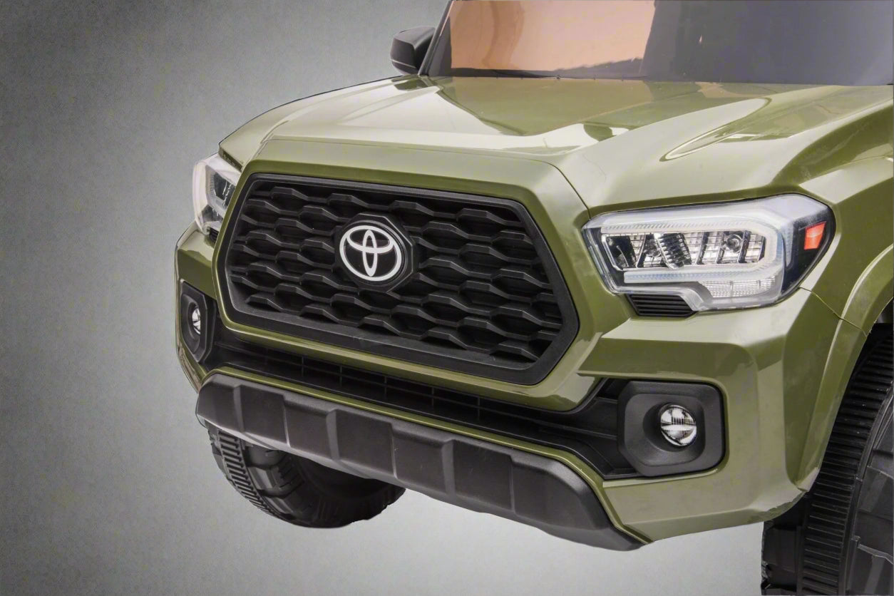 Olive green Toyota-style ride-on pickup truck for kids

Side view of remote-control kids truck with leather seat

Child’s electric ride-on truck with LED headlights

Toyota ride-on truck in olive green with suspension

Battery-powered pickup truck for toddlers