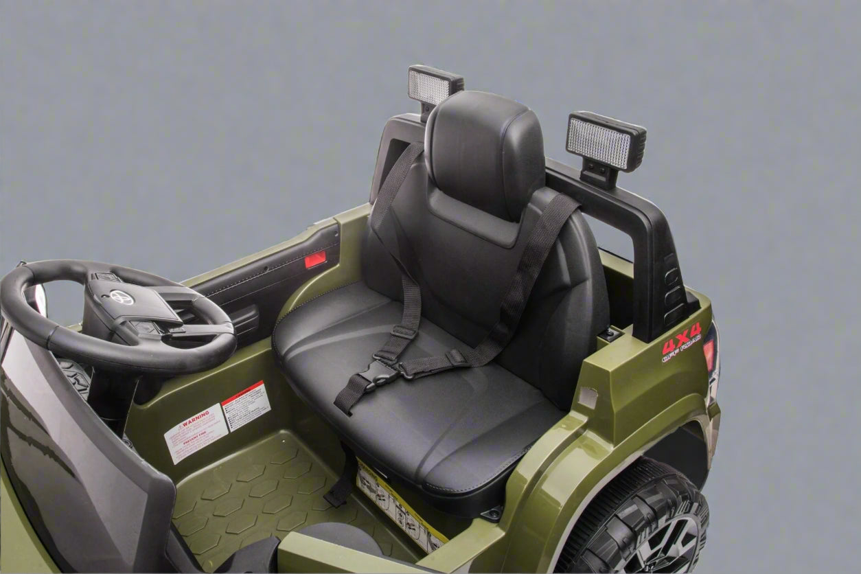 Olive green Toyota-style ride-on pickup truck for kids

Side view of remote-control kids truck with leather seat

Child’s electric ride-on truck with LED headlights

Toyota ride-on truck in olive green with suspension

Battery-powered pickup truck for toddlers