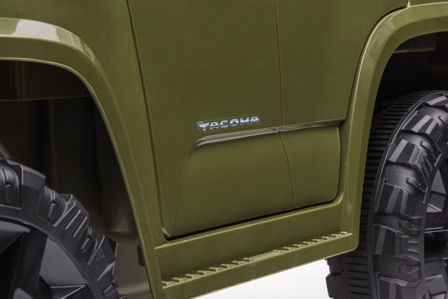 Olive green Toyota-style ride-on pickup truck for kids

Side view of remote-control kids truck with leather seat

Child’s electric ride-on truck with LED headlights

Toyota ride-on truck in olive green with suspension

Battery-powered pickup truck for toddlers