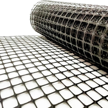 BX131X164 biaxial geogrid roll for soil reinforcement
Geogrid mesh for road base construction
Heavy-duty bidirectional geogrid unrolled on gravel
Close-up of high-tensile geogrid fabric