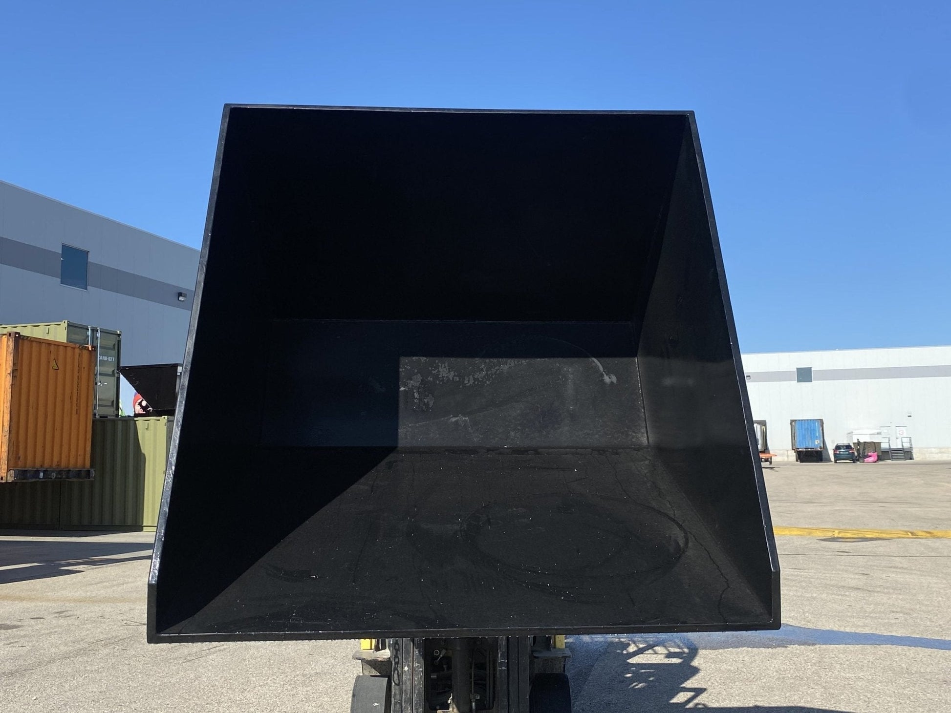 "Standard duty black forklift dump hopper in outdoor warehouse"

"Heavy-duty red tip bin hopper forklift compatible"

"Industrial forklift hopper with automatic bumper release"

"3 cubic yard black steel dump bin"

"Heavy-duty forklift tipping hopper with reinforced frame"