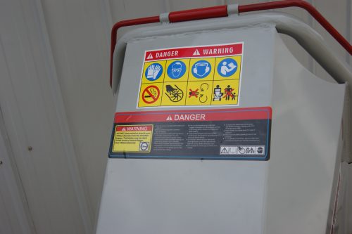 15 HP Kohler electric start wood chipper – trailer mounted front view
Side profile of 420cc wood chipper with hitch and tires
Chipper machine close-up showing large intake chute and rotor
Kohler engine wood chipper parked outdoors with debris