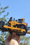 Realistic 1:50 diecast bulldozer toy on white background
Yellow metal bulldozer model with detailed scoop
Mini construction bulldozer toy for kids and collectors
Side view of zinc alloy bulldozer toy
