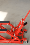1500 lb red motorcycle and ATV jack with hydraulic lift and swivel wheels


