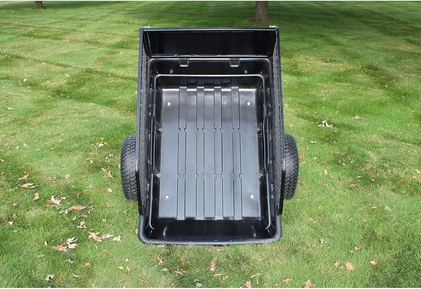 1500 lbs off-road utility trailer hitched to ATV in grass field

heavy-duty dump trailer with tilting steel bed

model 113484 utility trailer with 18-inch off-road tires

rear view of utility trailer loaded with gravel

close-up of powder-coated steel dump bed

