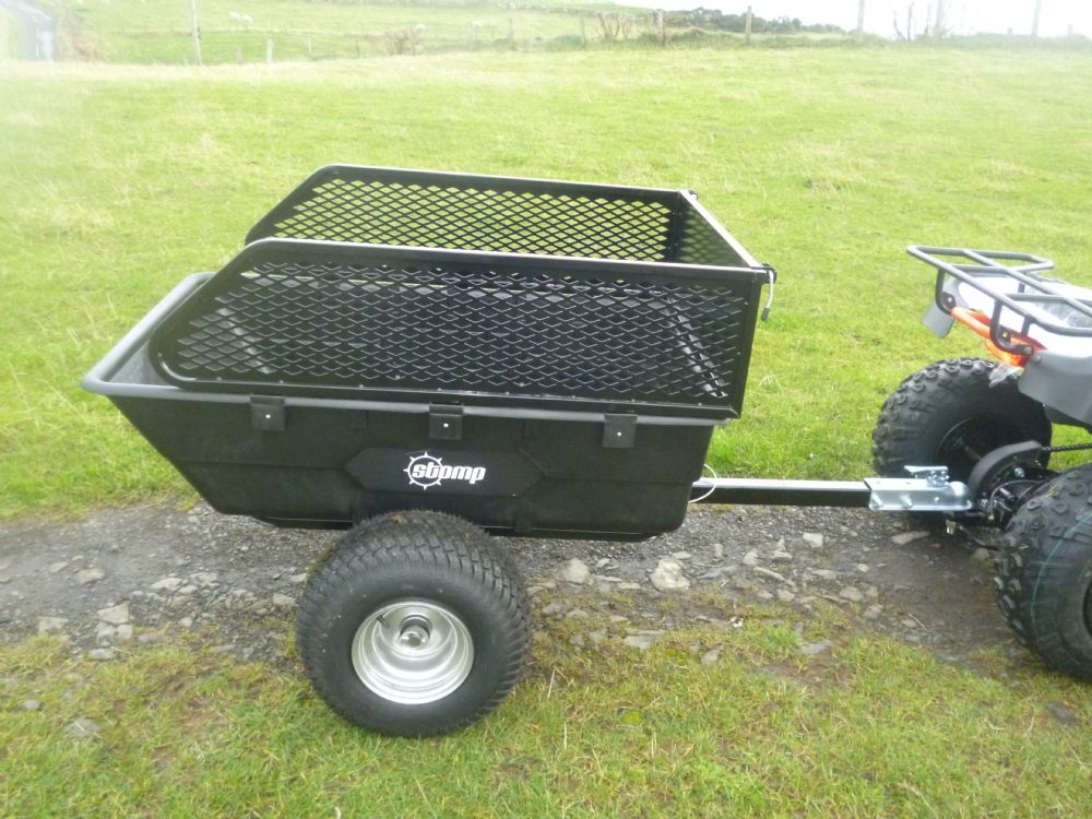 1500 lbs off-road utility trailer hitched to ATV in grass field

heavy-duty dump trailer with tilting steel bed

model 113484 utility trailer with 18-inch off-road tires

rear view of utility trailer loaded with gravel

close-up of powder-coated steel dump bed

