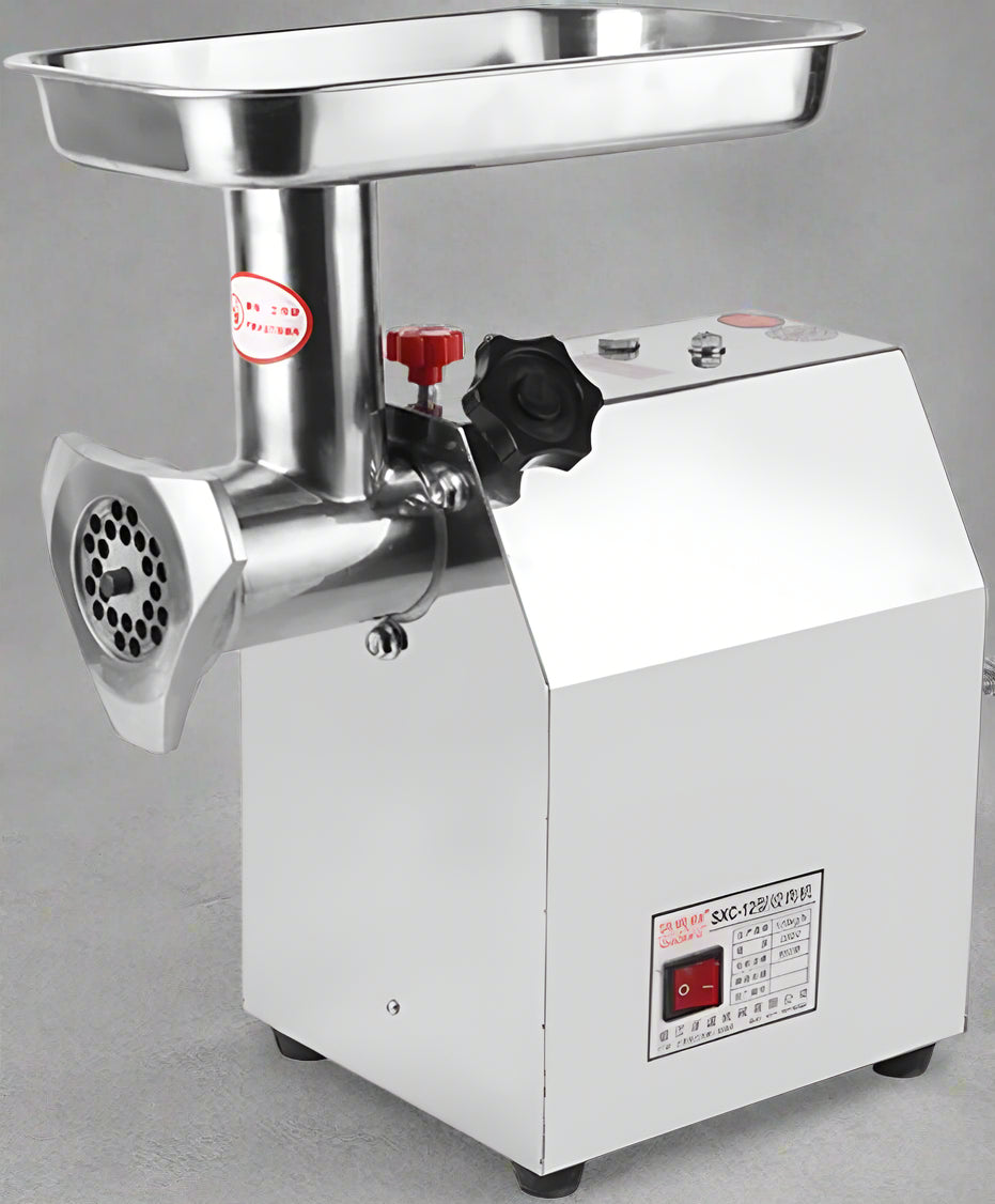 175KG Commercial Meat Grinder – 1HP Stainless Steel Unit front view
Grinder body and motor housing – stainless steel construction
Meat processing demonstration with grinder accessories
Grinding pork, fish, ginger with 710TK12 meat grinder
