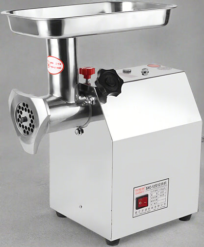 175KG Commercial Meat Grinder – 1HP Stainless Steel Unit front view
Grinder body and motor housing – stainless steel construction
Meat processing demonstration with grinder accessories
Grinding pork, fish, ginger with 710TK12 meat grinder