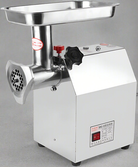 175KG Commercial Meat Grinder – 1HP Stainless Steel Unit front view
Grinder body and motor housing – stainless steel construction
Meat processing demonstration with grinder accessories
Grinding pork, fish, ginger with 710TK12 meat grinder