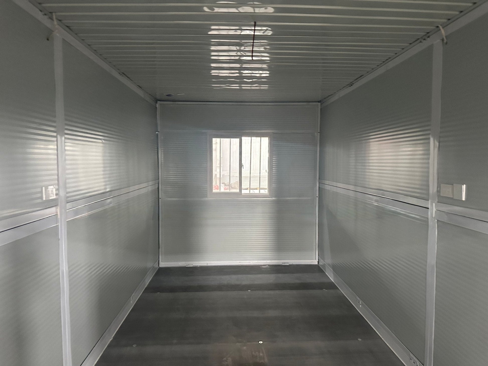 Exterior Image: Portable 19 FT Folding Insulated Container Office with Lockable Door – Outdoor View

Interior Image: Inside View of Modular Prefab Cabin Office with Window and Electrical Plug

Folded View: Foldable Prefab Container for Easy Transport and Setup

Setup Process: Step-by-step Setup of 19 FT Folding Steel Container Office

Multiple Angles: Various Views of the Portable Modular Work Cabin