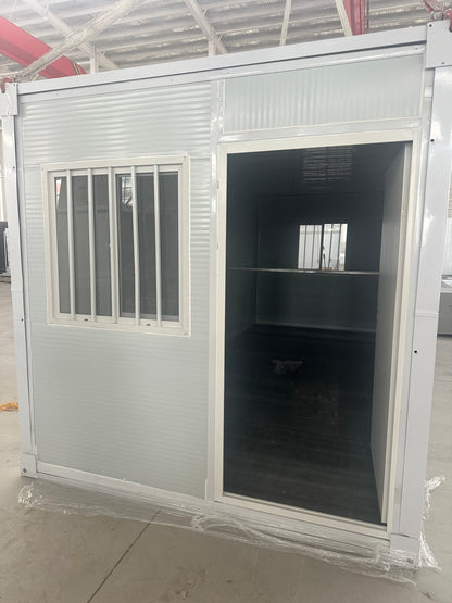 Exterior Image: Portable 19 FT Folding Insulated Container Office with Lockable Door – Outdoor View

Interior Image: Inside View of Modular Prefab Cabin Office with Window and Electrical Plug

Folded View: Foldable Prefab Container for Easy Transport and Setup

Setup Process: Step-by-step Setup of 19 FT Folding Steel Container Office

Multiple Angles: Various Views of the Portable Modular Work Cabin