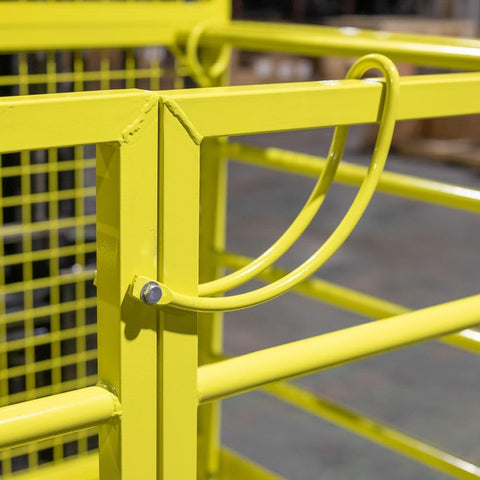 Yellow 2-person forklift safety cage with mesh floor

Forklift lifting steel work platform in industrial setting

OSHA-compliant safety cage with lockable gate

Close-up of forklift cage fork pockets and frame

Overhead maintenance platform for warehouse use