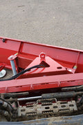Skid steer clearing snow using Bendall hydraulic snow plow

Bendall 96” red snow plow angled to the side

Close-up of adjustable skid shoes and hydraulic fittings

Rear view of snow blade attached to skid steer

Bolt-on reversible cutting edge on Bendall plow