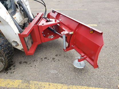 Skid steer clearing snow using Bendall hydraulic snow plow

Bendall 96” red snow plow angled to the side

Close-up of adjustable skid shoes and hydraulic fittings

Rear view of snow blade attached to skid steer

Bolt-on reversible cutting edge on Bendall plow